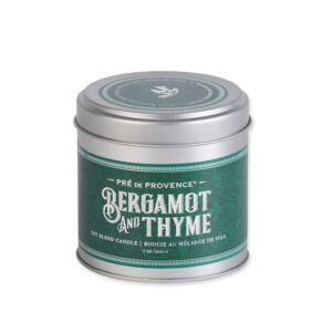 bergamot and thyme scented candle in a tin with green label