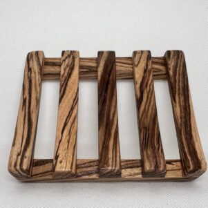 soap dish made from an exclusive zebra wood with slats.