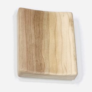 soap dish made from cherry wood in a light finish. flat smooth design with a slight curve