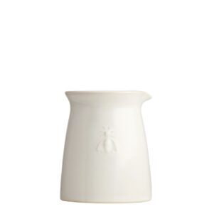 ceramic creamer in a soft white color with a bee imprinted on the front. capacity is 6 oz and it measures 3.6" tall