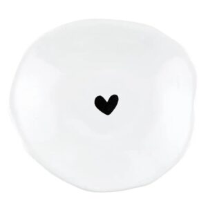 white ceramic dip bowl with a small black heart in the center. edges are not perfectly round giving it a handmade look