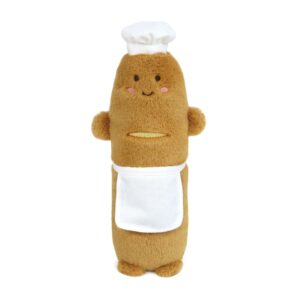 stuffed toy in the shape of a baguette with a smiling face wearing an apron and chef's hat