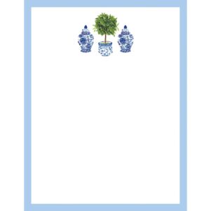 white notepad with light blue trim around it with a potted topiary plant in the top center with a blue and white ginger jar on each side