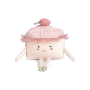stuffed toy cake slice with a smile, a berry on top of her head and pink tulle around her bonnet