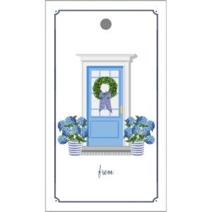white gift tag with a blue door in the middle surrounded by potted hydrangeas and a wreath on the door