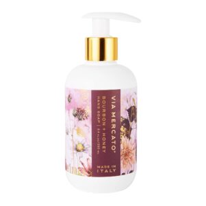 liquid soap pump white bottle with burgundy and pink floral label. honey bourbon scented soap