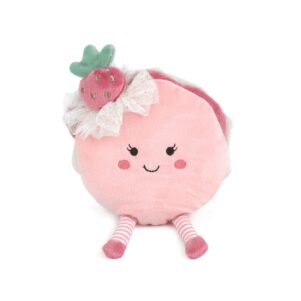 plush toy in the shape of a macaron with a smile on her pink face and a strawberry as a hat